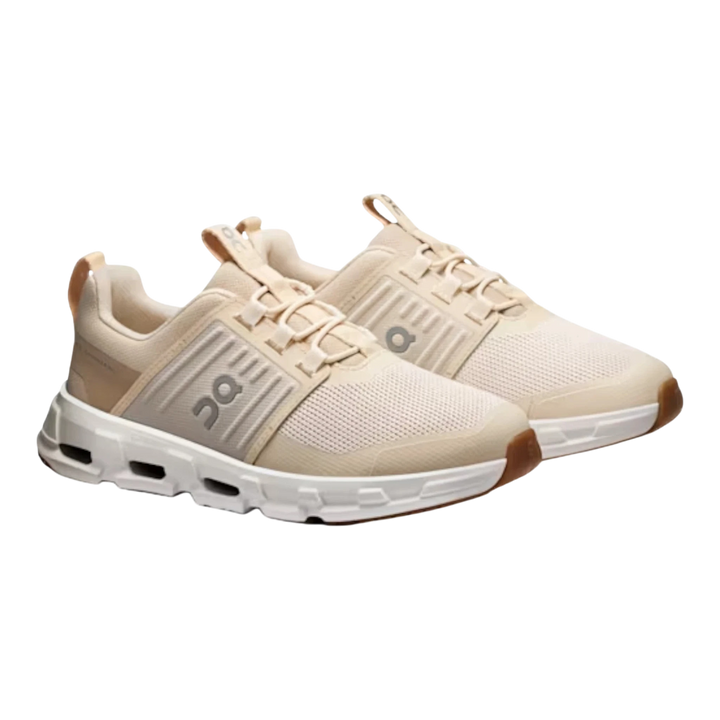 HypeSelection Cloudswift kids sand sneakers with mesh uppers, elastic laces, and white soles.