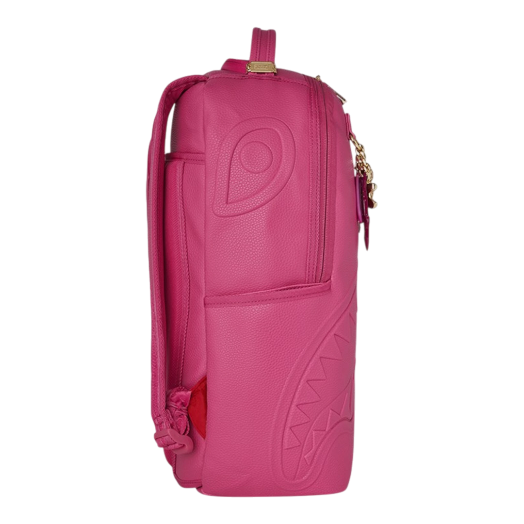 HypeSelection SHARK PINK ATTACK backpack with iconic shark mouth graphic, pink PVC exterior, gold-tone zipper, and embossed eye detail.