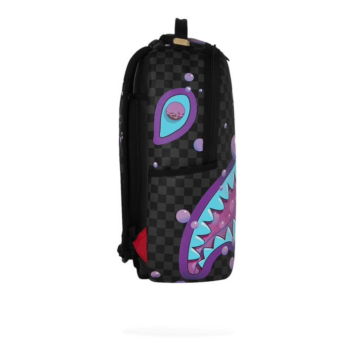 HypeSelection Sprayground Purple Slime Takeover backpack with black checkered pattern, purple and blue shark graphic, and bubble details.