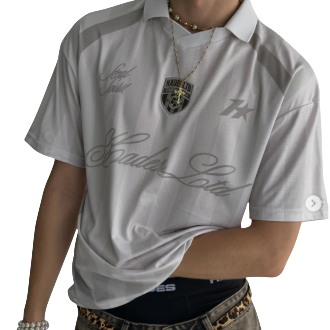 HADES Legends Spirit Jersey in white polyester mesh with oversized fit and athletic graphics. Features a collared neckline and short sleeves.