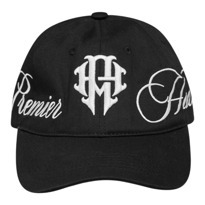 HADES Studio black unstructured dad cap with white embroidered crest and text on front and side panels. Adjustable metal buckle closure.