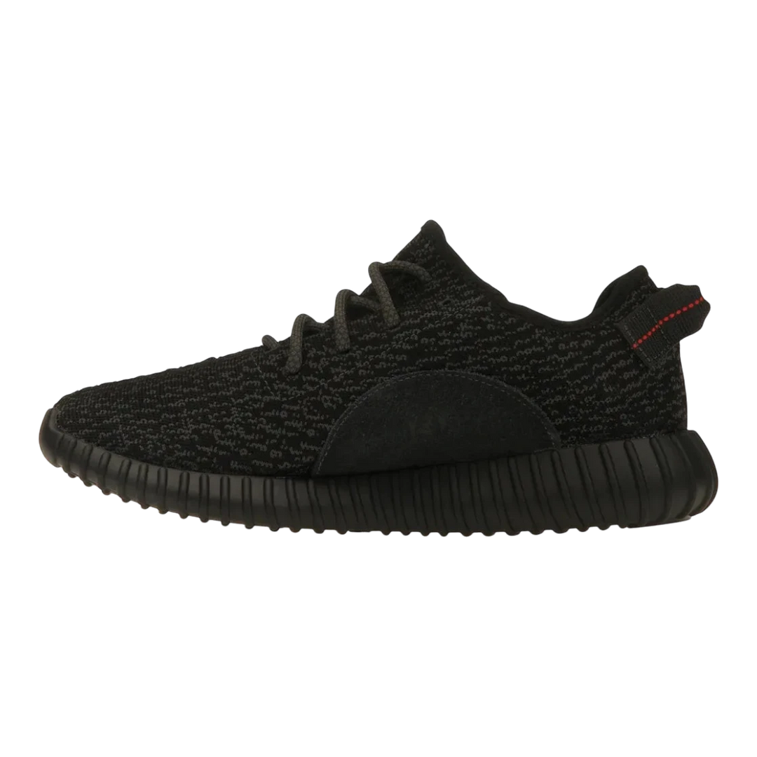 HypeSelection adidas Yeezy Boost 350 Pirate Black 2023 sneaker with black Primeknit upper and red heel tab stitching.