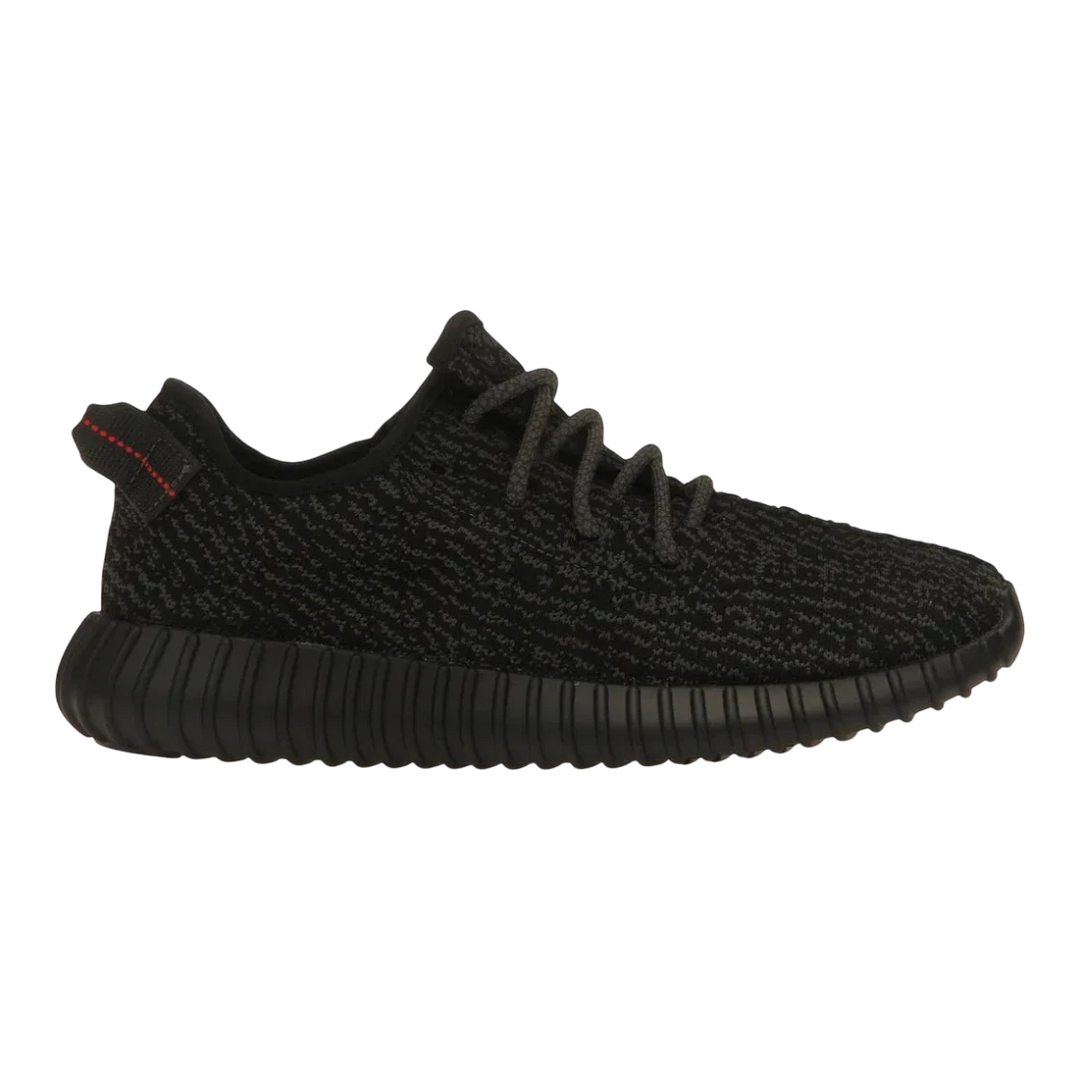 HypeSelection adidas Yeezy Boost 350 Pirate Black 2023 sneaker with black Primeknit upper and red heel tab stitching.