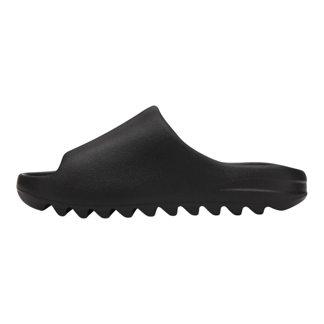 HypeSelection black adidas Yeezy Slide "Onyx" slip-on sandal made from injected EVA foam with a contoured footbed and serrated outsole.