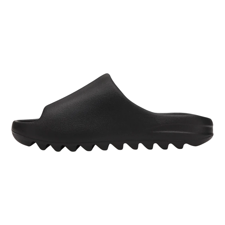 HypeSelection black adidas Yeezy Slide "Onyx" slip-on sandal made from injected EVA foam with a contoured footbed and serrated outsole.