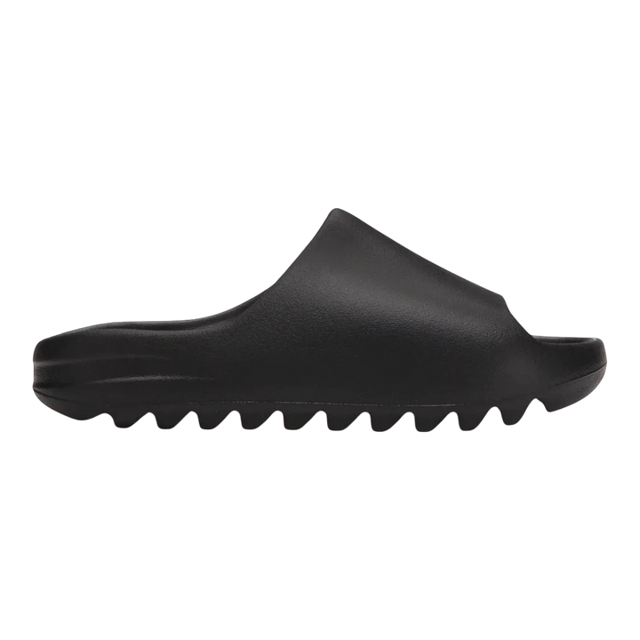 HypeSelection adidas Yeezy Slide Onyx black slip-on slides made from injected EVA foam with contoured footbed.