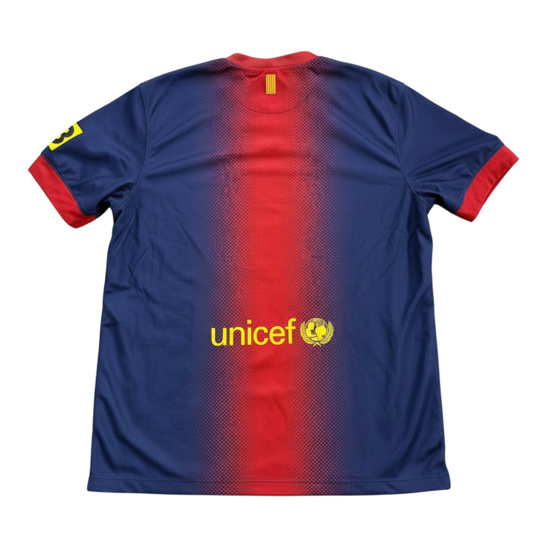 HypeSelection vintage 2012-13 FC Barcelona home shirt with gradient red and blue stripes, UNICEF logo, and yellow number 3 on sleeve.
