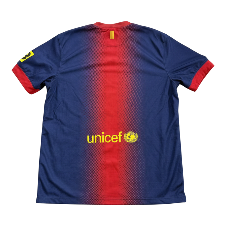 HypeSelection vintage 2012-13 FC Barcelona home shirt with gradient red and blue stripes, UNICEF logo, and yellow number 3 on sleeve.