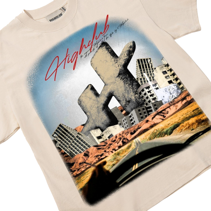 HypeSelection beige 100% cotton oversized tee with a large-scale, cinematic graphic print of a post-apocalyptic desert landscape and crumbling HC monogram.