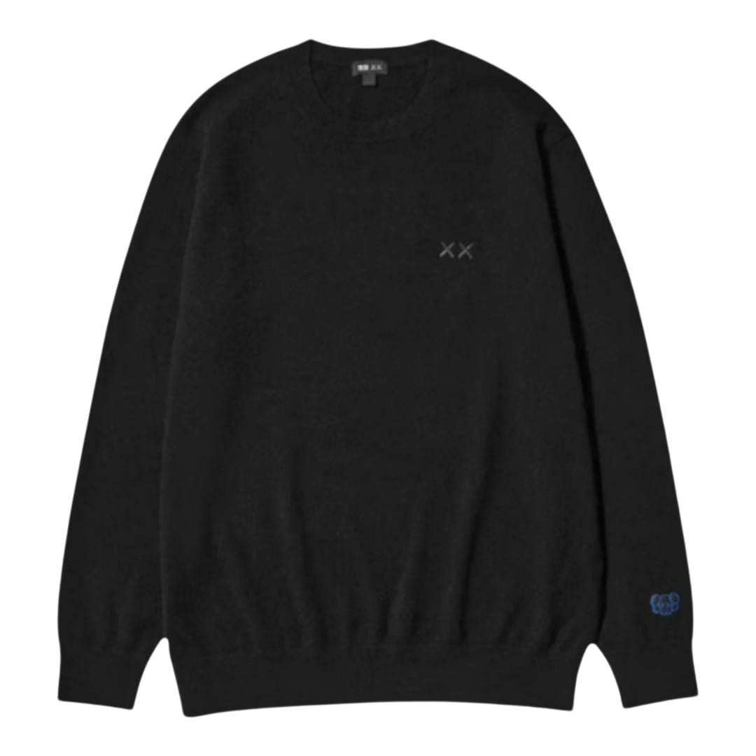 HypeSelection black 100% cashmere crew neck sweater with embroidered KAWS XX detail on chest and sleeve.