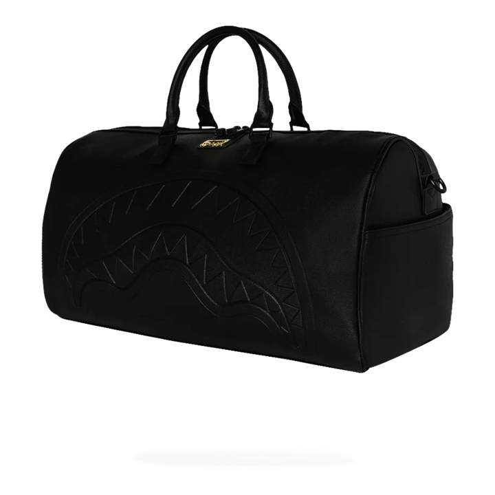 HypeSelection black eco-leather duffle bag with embossed shark mouth design and gold zipper detail.