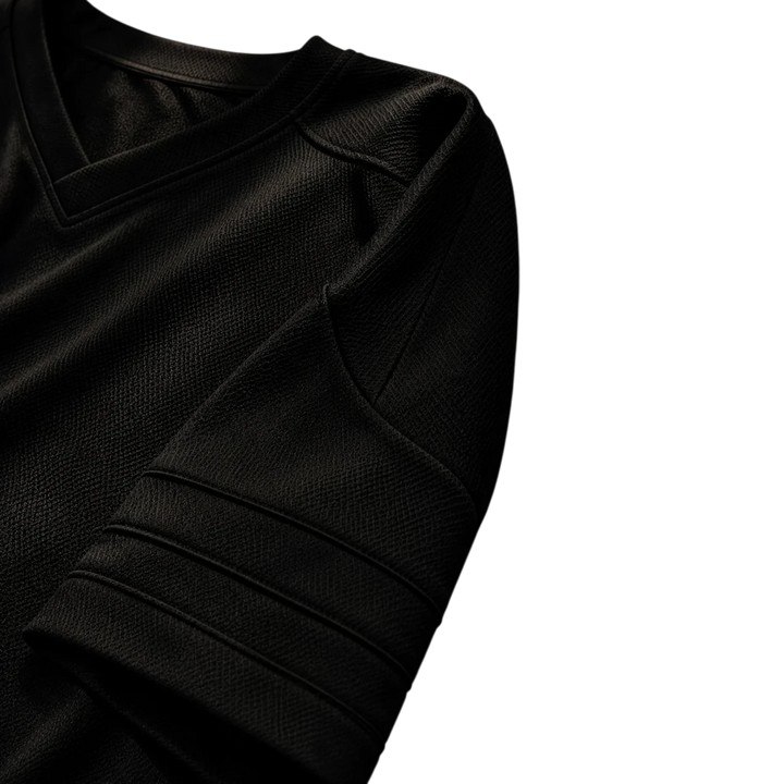HypeSelection black lifestyle football jersey featuring a textured fabric and v-neck collar detail.