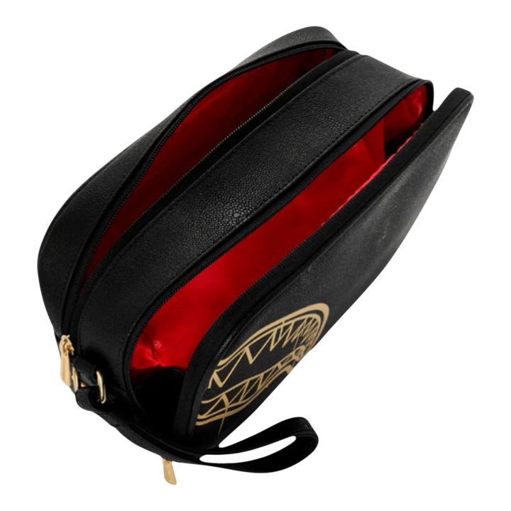HypeSelection black toiletry bag with gold graphic and red interior. Structured, zippered case for travel or everyday essentials.