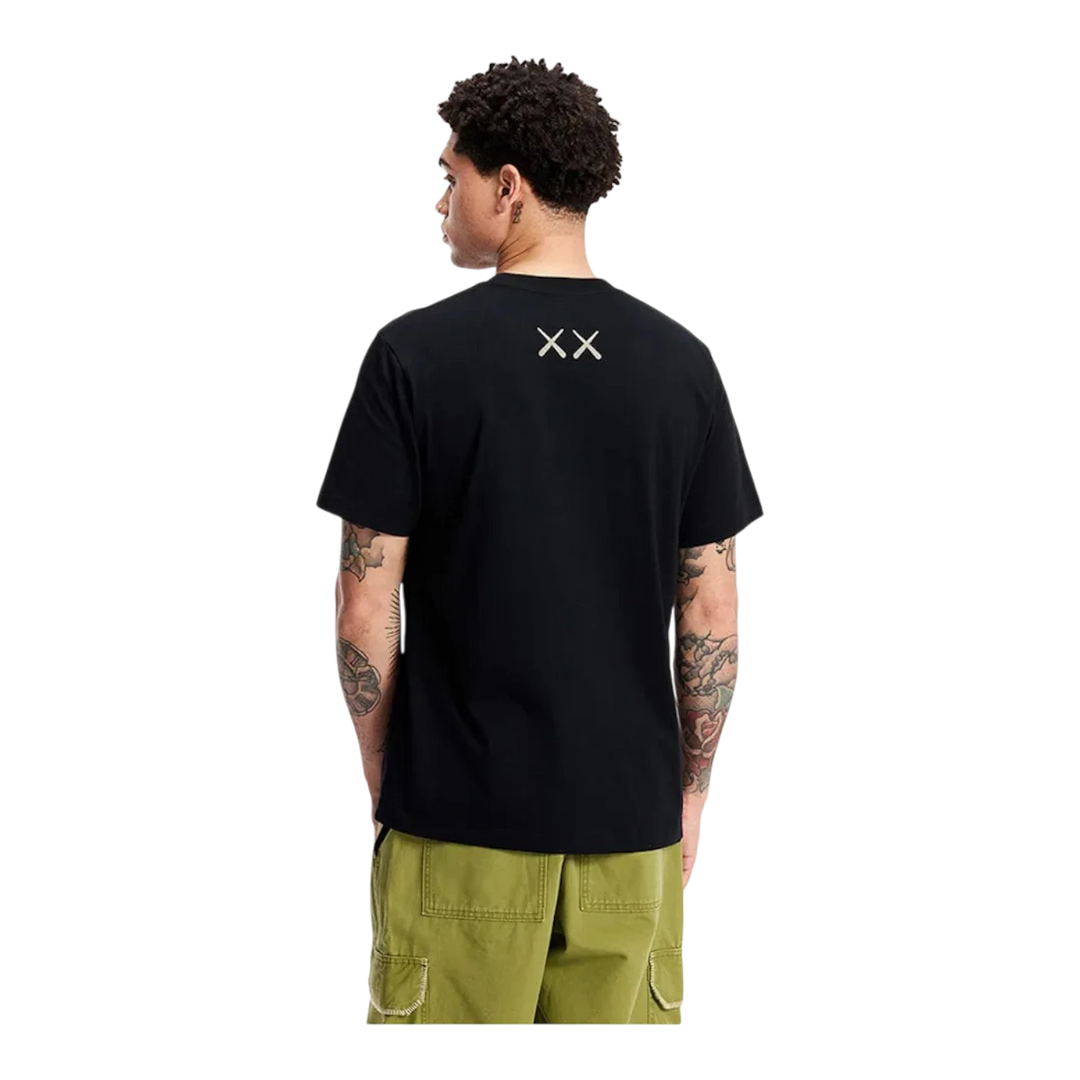 HypeSelection black cotton KAWS x Uniqlo UT short sleeve t-shirt with XX graphic on back.