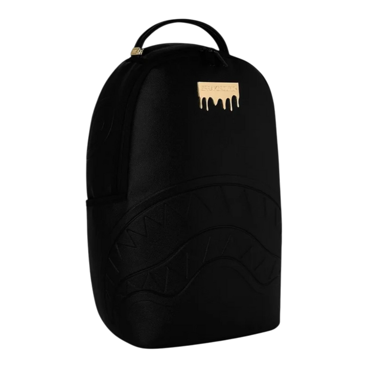 HypeSelection black PVC backpack with gold drip logo and embossed shark teeth graphic. Features velour laptop sleeve and ergonomic padding.