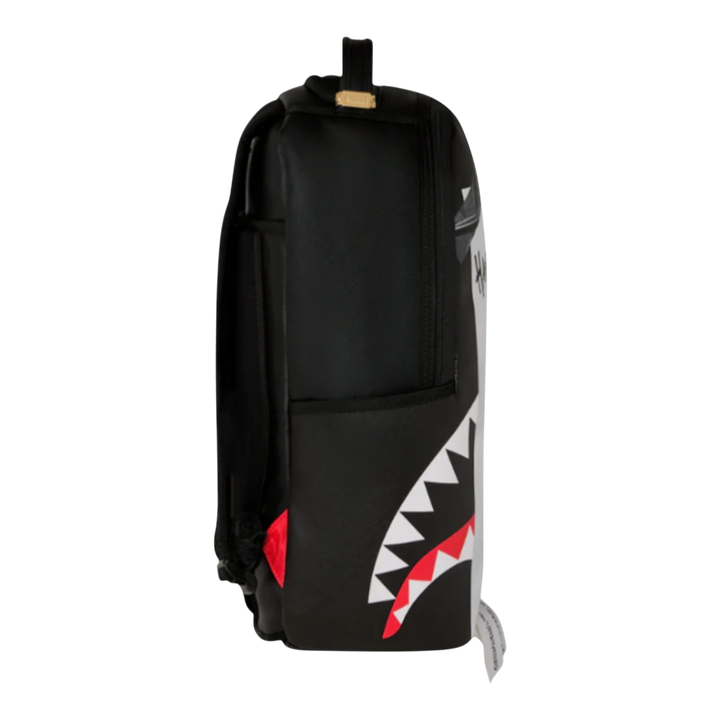 HypeSelection Sprayground black faux leather backpack with multicolor shark mouth graphic and red accents.