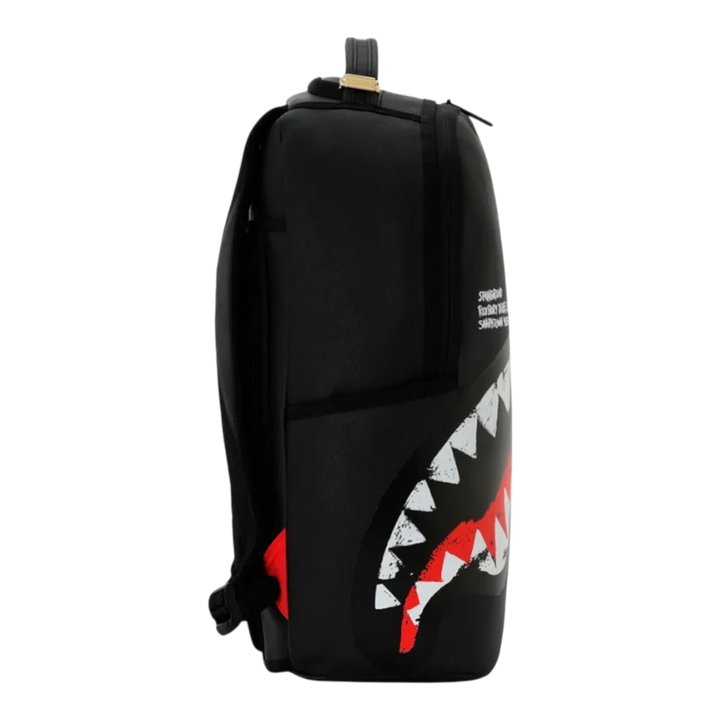 HypeSelection black Sprayground Shark Central backpack with iconic red and white embroidered shark teeth graphic