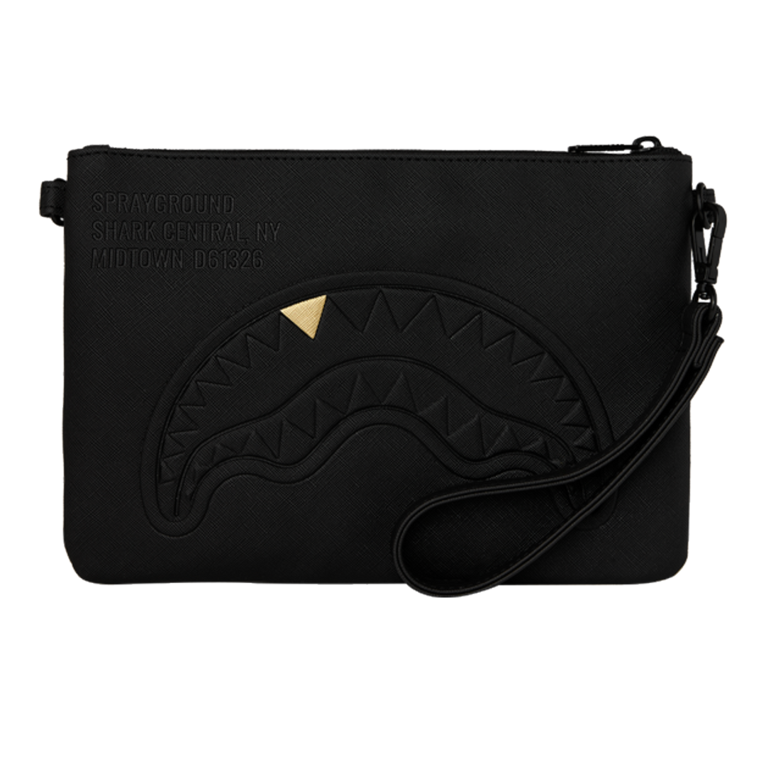 HypeSelection black Sprayground Golden Fang shark clutch with a gold tooth detail and wrist strap.
