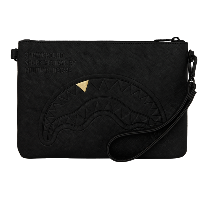 HypeSelection black Sprayground Golden Fang shark clutch with a gold tooth detail and wrist strap.