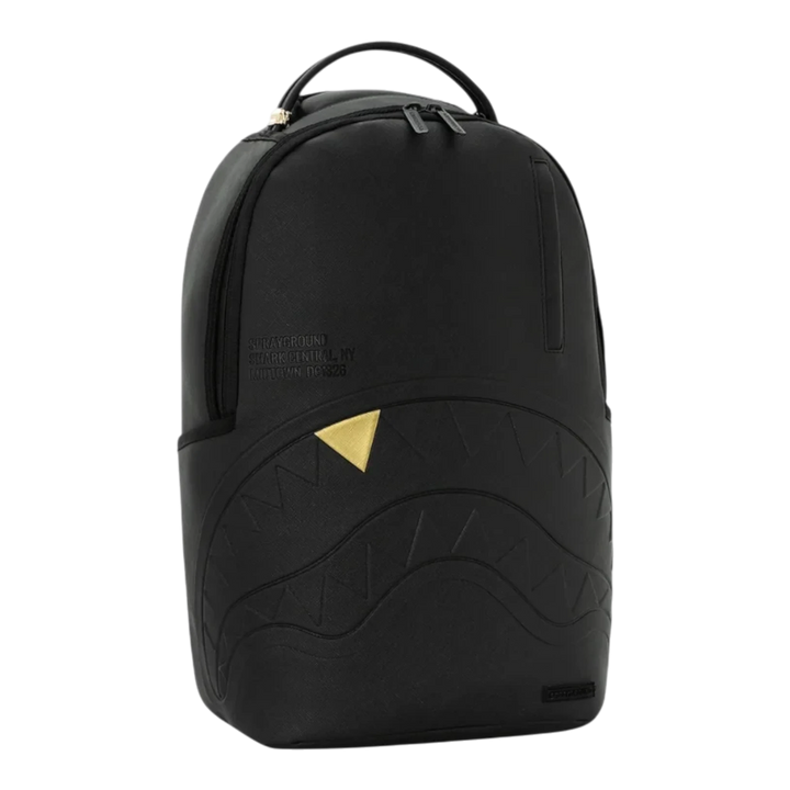 HypeSelection Sprayground blacked out backpack with embossed shark mouth design and a single gold tooth detail.
