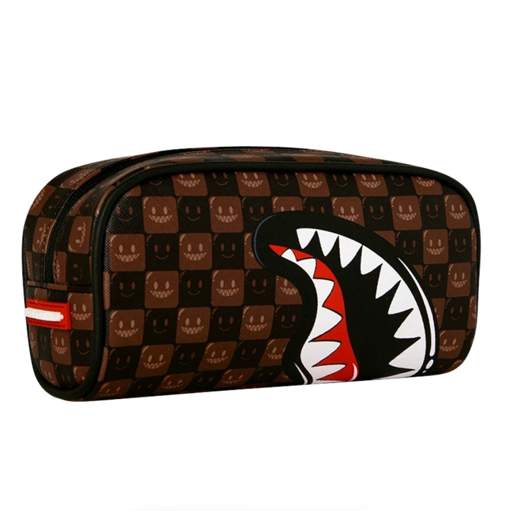 HypeSelection brown checkered pouch featuring the signature Sprayground shark mouth graphic and smiling face pattern.