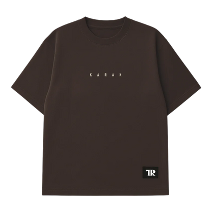 HypeSelection brown heavyweight cotton t-shirt with 'KARAK' text graphic and TR logo patch. Oversized fit.