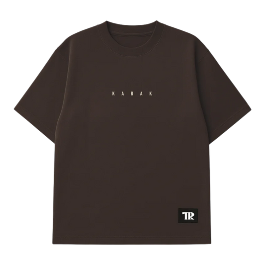 HypeSelection brown heavyweight cotton t-shirt with 'KARAK' text graphic and TR logo patch. Oversized fit.
