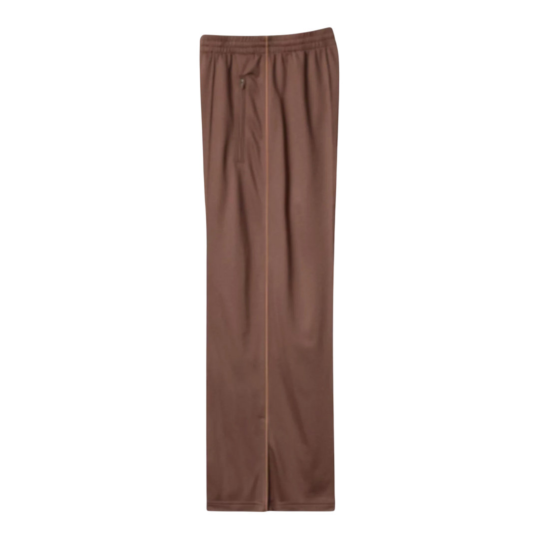 HypeSelection Uniqlo JW Anderson brown polyester track pants with contrast piping and zip hems.