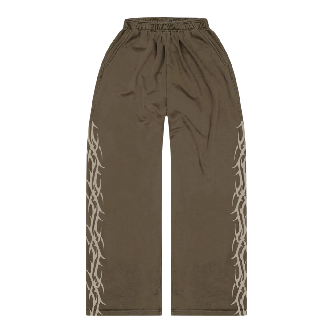 HypeSelection brown tribal print sweatpants made from 100% cotton French terry with an oversized fit and elastic waistband.