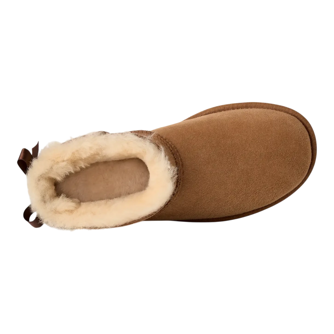 HypeSelection UGG Ultra Mini Bailey Bow boot in chestnut suede with plush wool lining and back satin bow detail