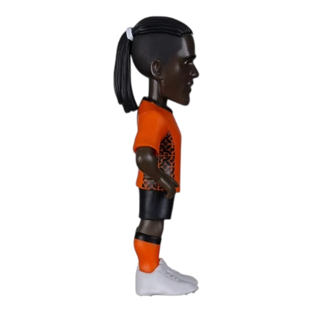 HypeSelection Minix Clarence Seedorf Netherlands collectible figure in orange kit with ponytail, side profile view.