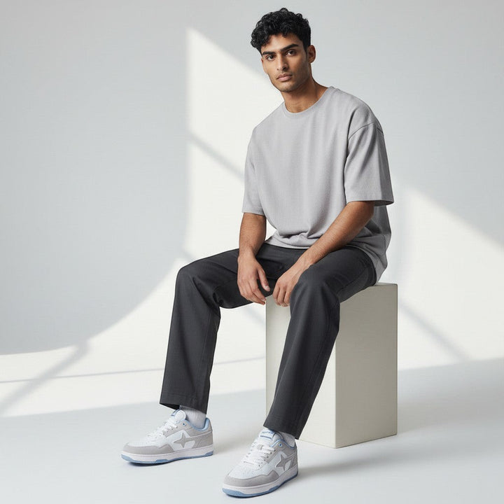 HypeSelection Comet X Lows Snow sneakers in white, grey, and light blue. Faux leather and suede upper with a star logo. Comfortable rubber sole.