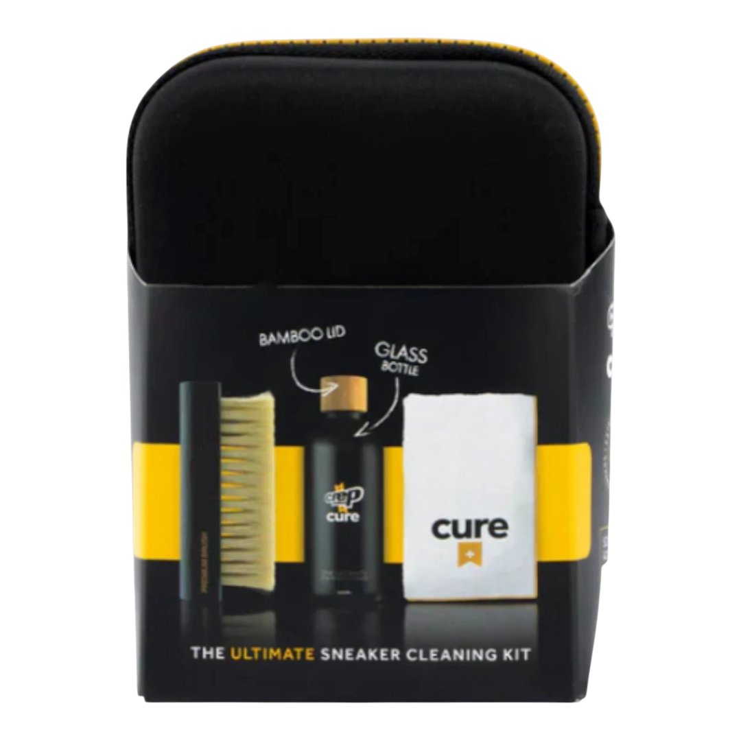 HypeSelection Crep Protect Cure Ultimate Sneaker Cleaning Kit with brush, cleaning solution bottle, and microfiber cloth in black and yellow packaging.
