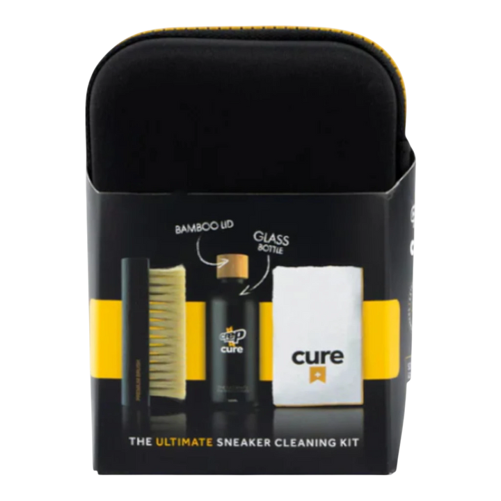 HypeSelection Crep Protect Cure Ultimate Sneaker Cleaning Kit with brush, cleaning solution bottle, and microfiber cloth in black and yellow packaging.