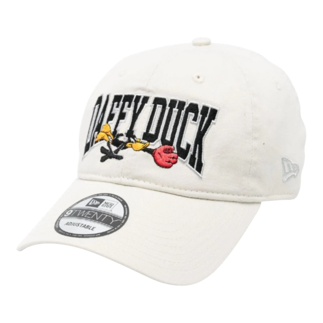 HypeSelection beige cotton 9Twenty cap with embroidered Daffy Duck graphic and New Era logo.