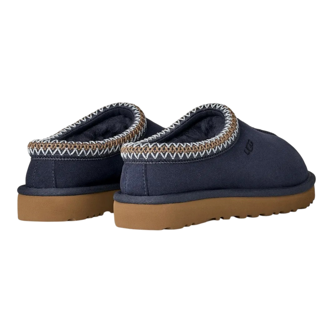 HypeSelection UGG Tasman II slippers in dark indigo suede with signature UGGbraid collar and brown EVA outsole.