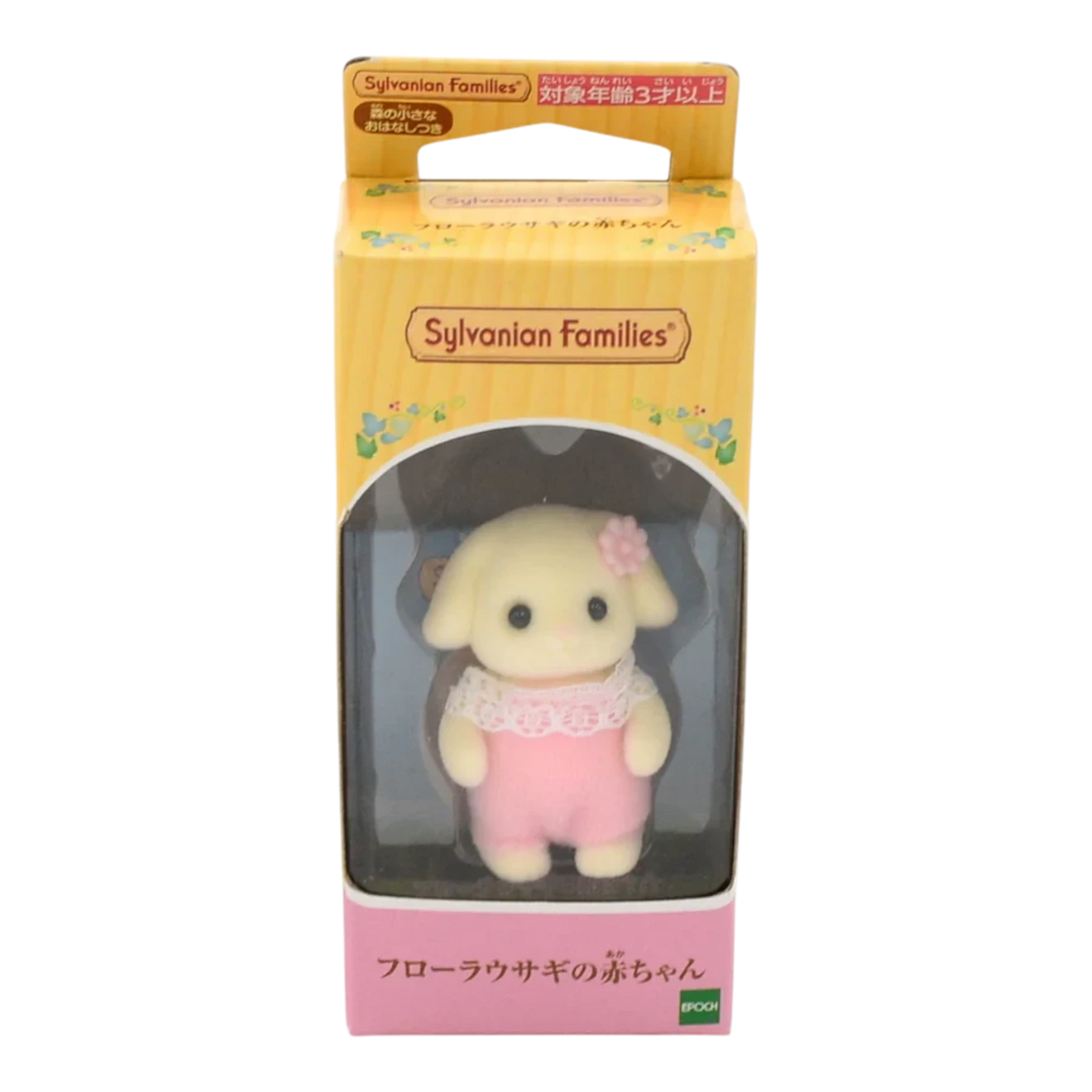 HypeSelection Flora Rabbit Baby toy, a cream-colored bunny with pink overalls and a lace collar, wearing a pink flower accessory.