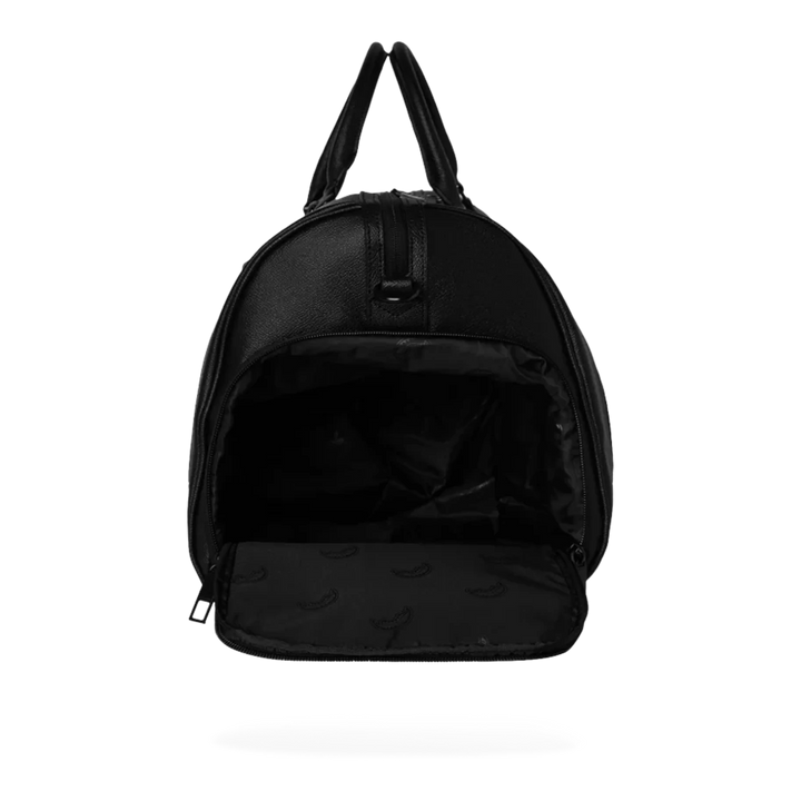HypeSelection Gold Brick Luxe Duffle, a black eco-leather duffle bag with an all-over gold brick pattern and gold zippers.