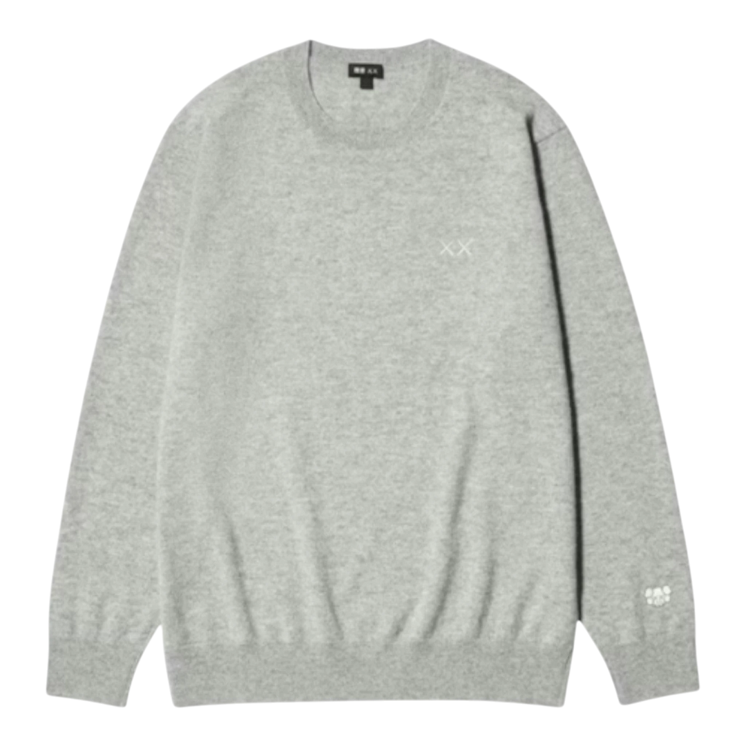 HypeSelection gray 100% cashmere crew neck sweater with embroidered KAWS XX detail on chest and sleeve.