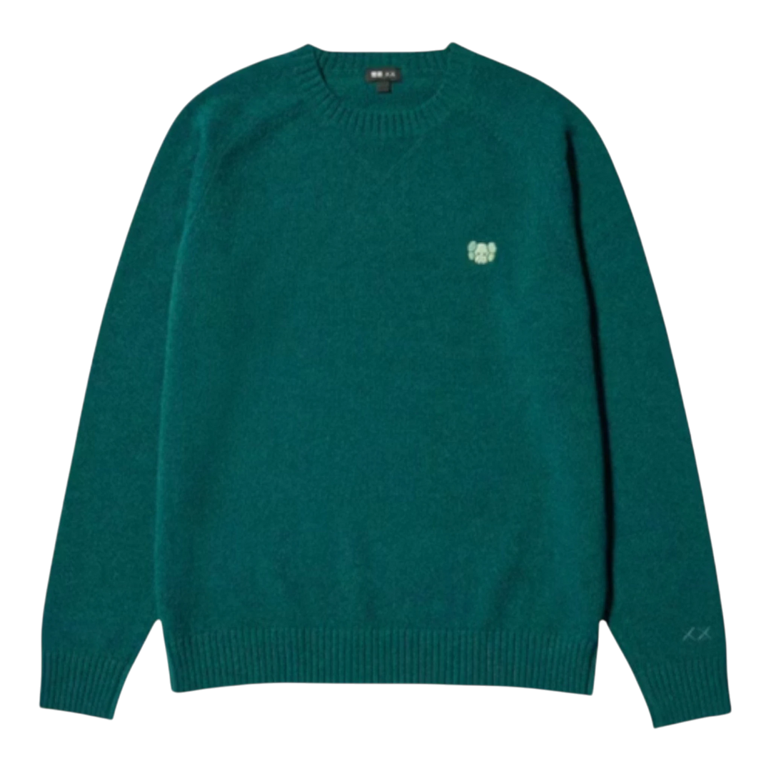 HypeSelection Uniqlo x KAWS green lambswool crew neck sweater with embroidered KAWS motif on chest and XX detail on sleeve.