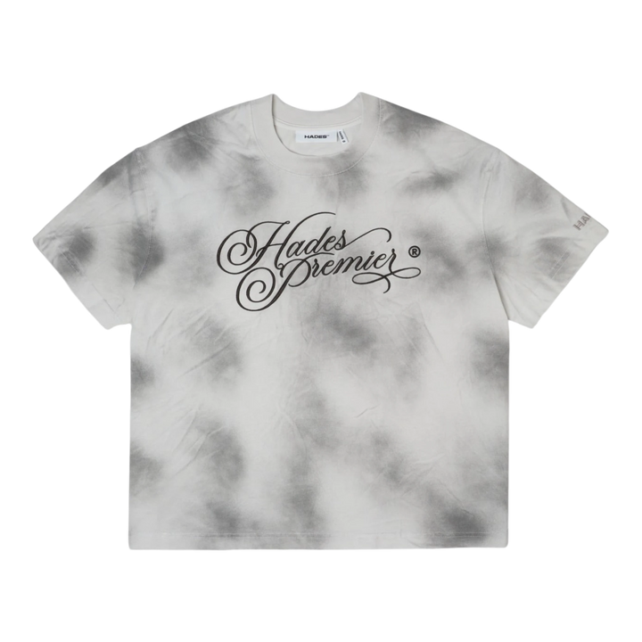 HypeSelection HADES Studio Ash Cloud Tee, a smoke grey tie-dye cotton t-shirt with a black "Hades Premier" graphic print on the front and a small logo on the sleeve.