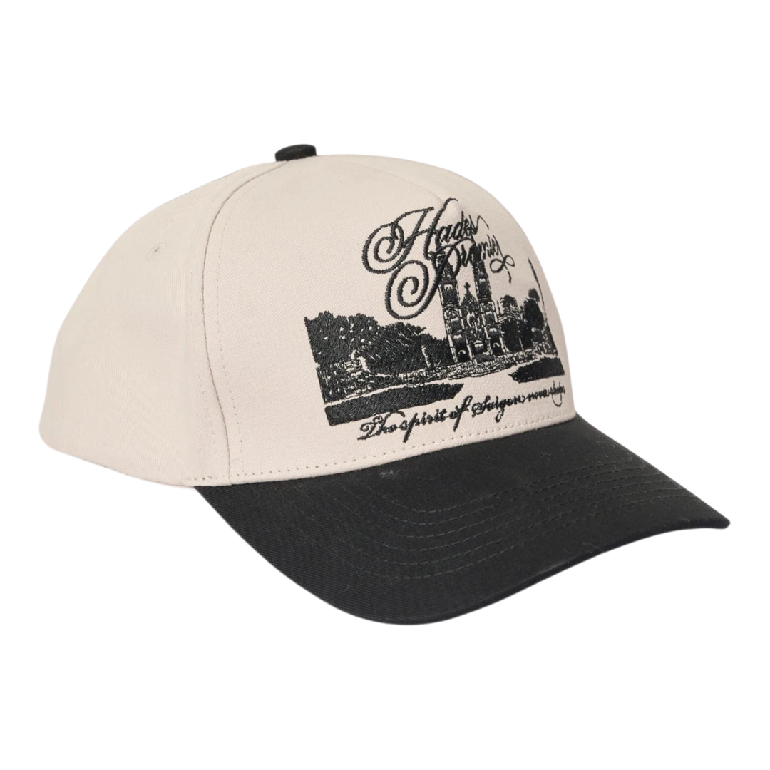 HypeSelection HADES Studio District 1 Cap in white cotton khaki with black brim and embroidered cathedral graphic.