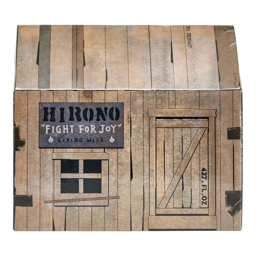 HypeSelection Hirono Living Wild Fight for Joy plush doll packaging designed as a rustic wooden cabin with a sign and window.