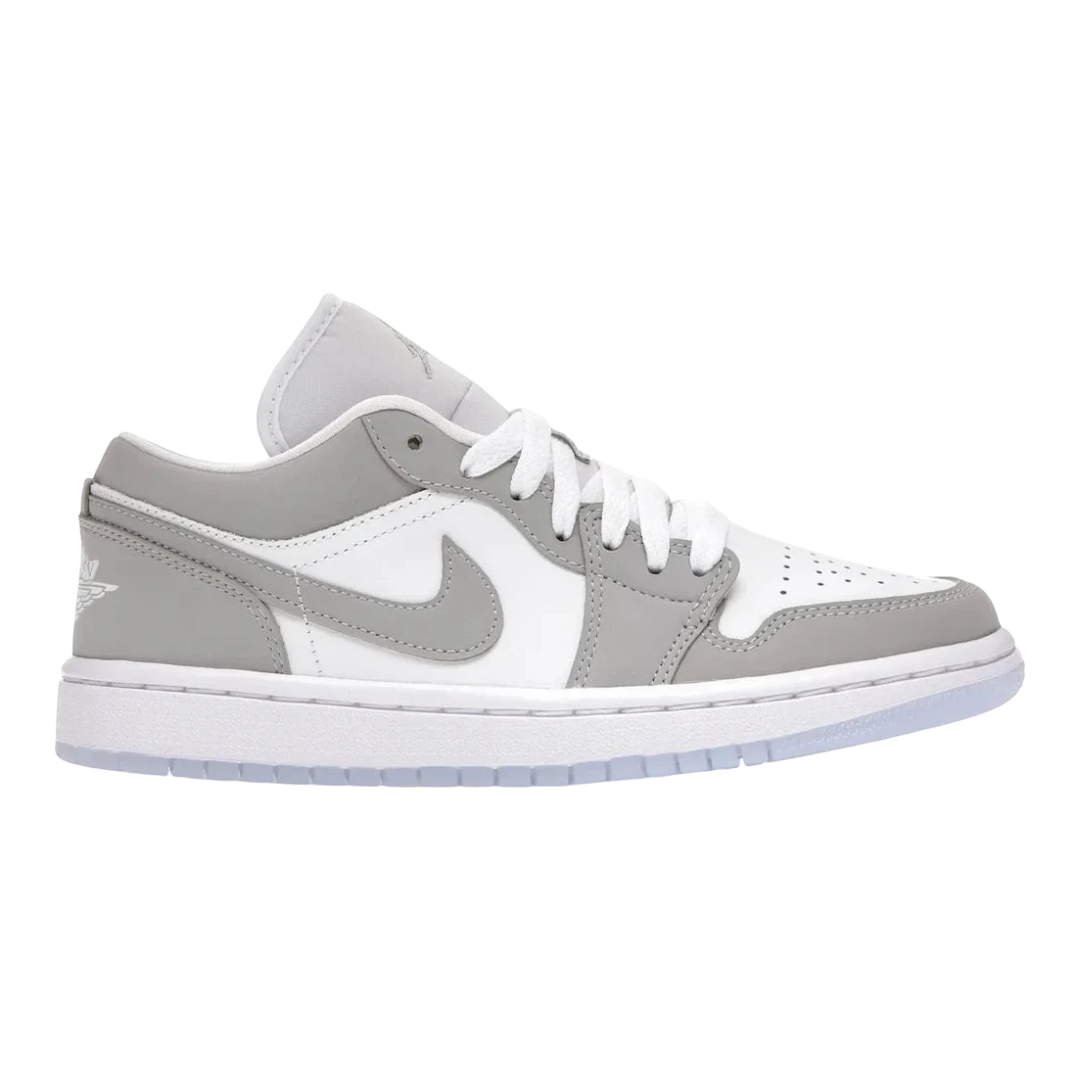 HypeSelection women's Jordan 1 Low Wolf Grey sneakers with white leather base, grey overlays, and translucent outsole.
