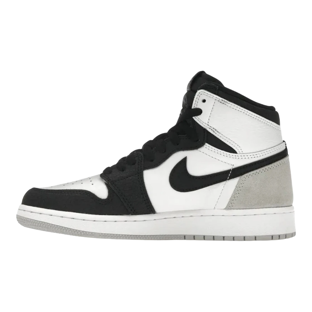 HypeSelection Jordan 1 Retro High OG GS in white, black, and grey with suede overlays and subtle coral accents.
