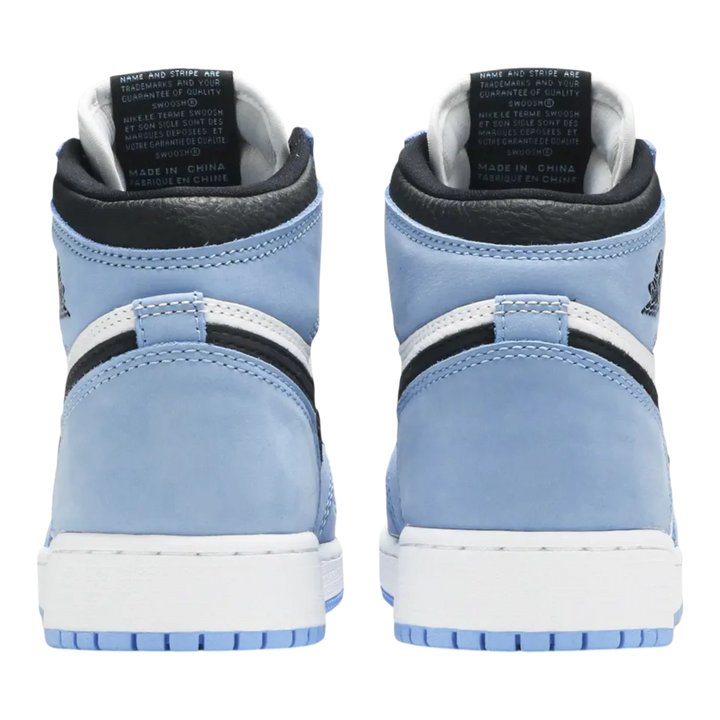 HypeSelection Jordan 1 Retro High OG University Blue GS sneakers with white leather and University Blue suede overlays, black accents, and white midsole.