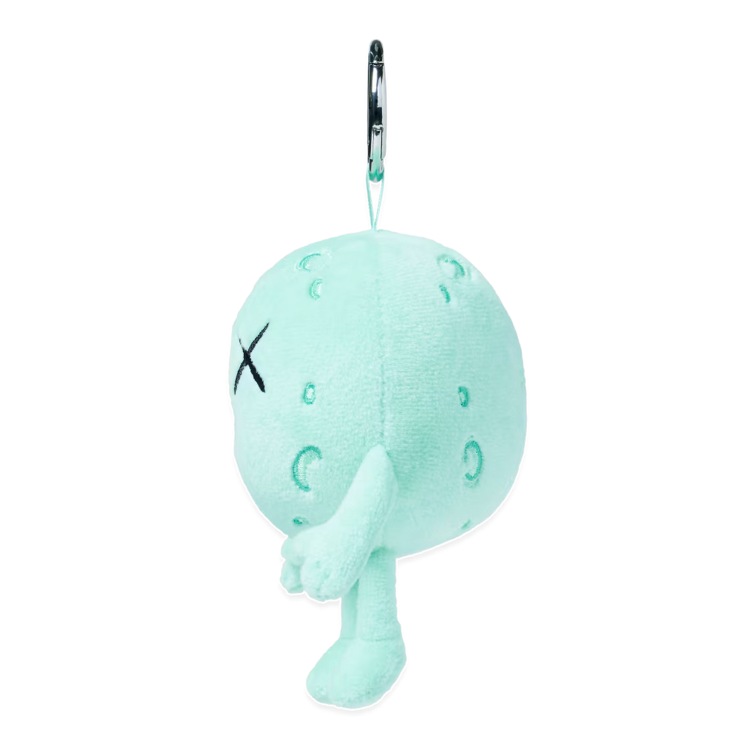 HypeSelection KAWS Universe Moon plush charm in light green with signature X-eye detail and silver keyring attachment