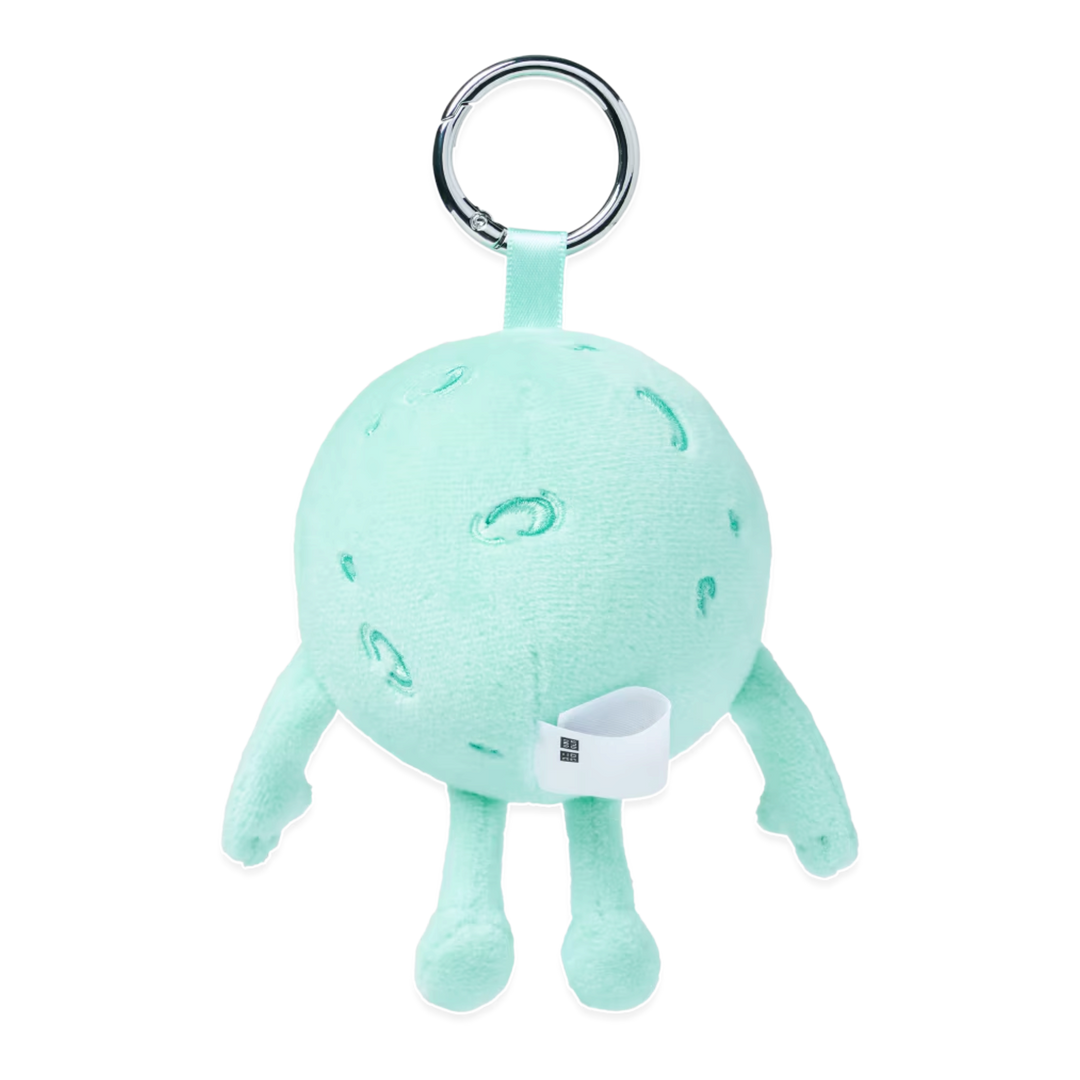 HypeSelection KAWS Universe Moon plush charm in light green with a silver keyring for bags and accessories.