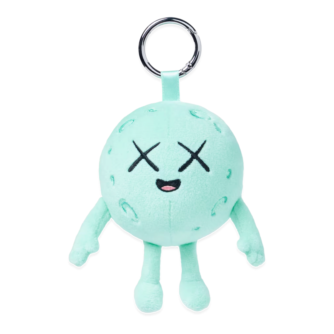 HypeSelection KAWS Universe Moon plush charm in light green with signature X eyes and metal keyring attachment.