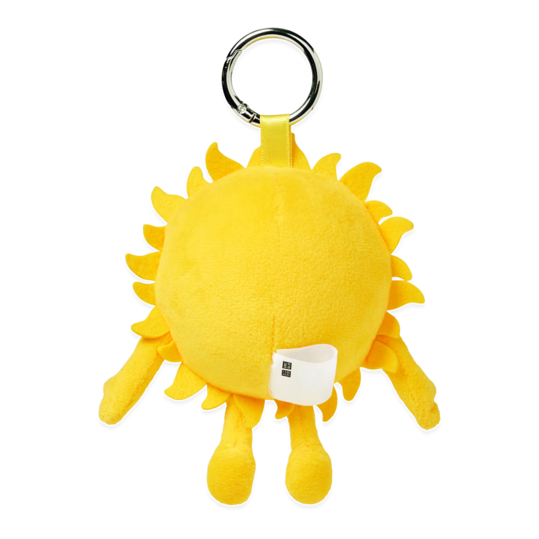 HypeSelection KAWS Universe yellow sun plush charm with a metal keyring for bags and accessories
